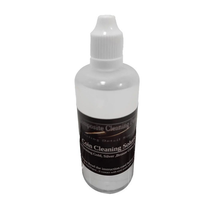 Bottle of coin cleaning solution on a white background