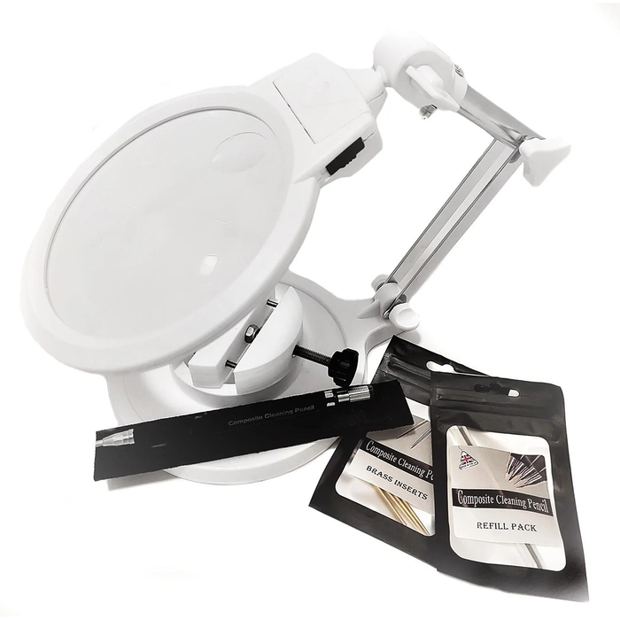 White magnifying glass with a stand and cleaning pencils on a white background