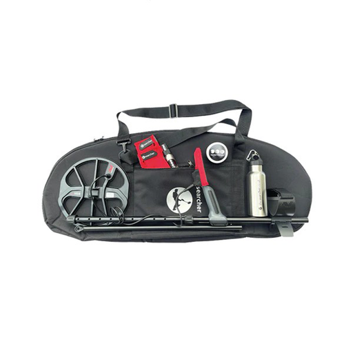 Black metal detecting bag with various components on a white background